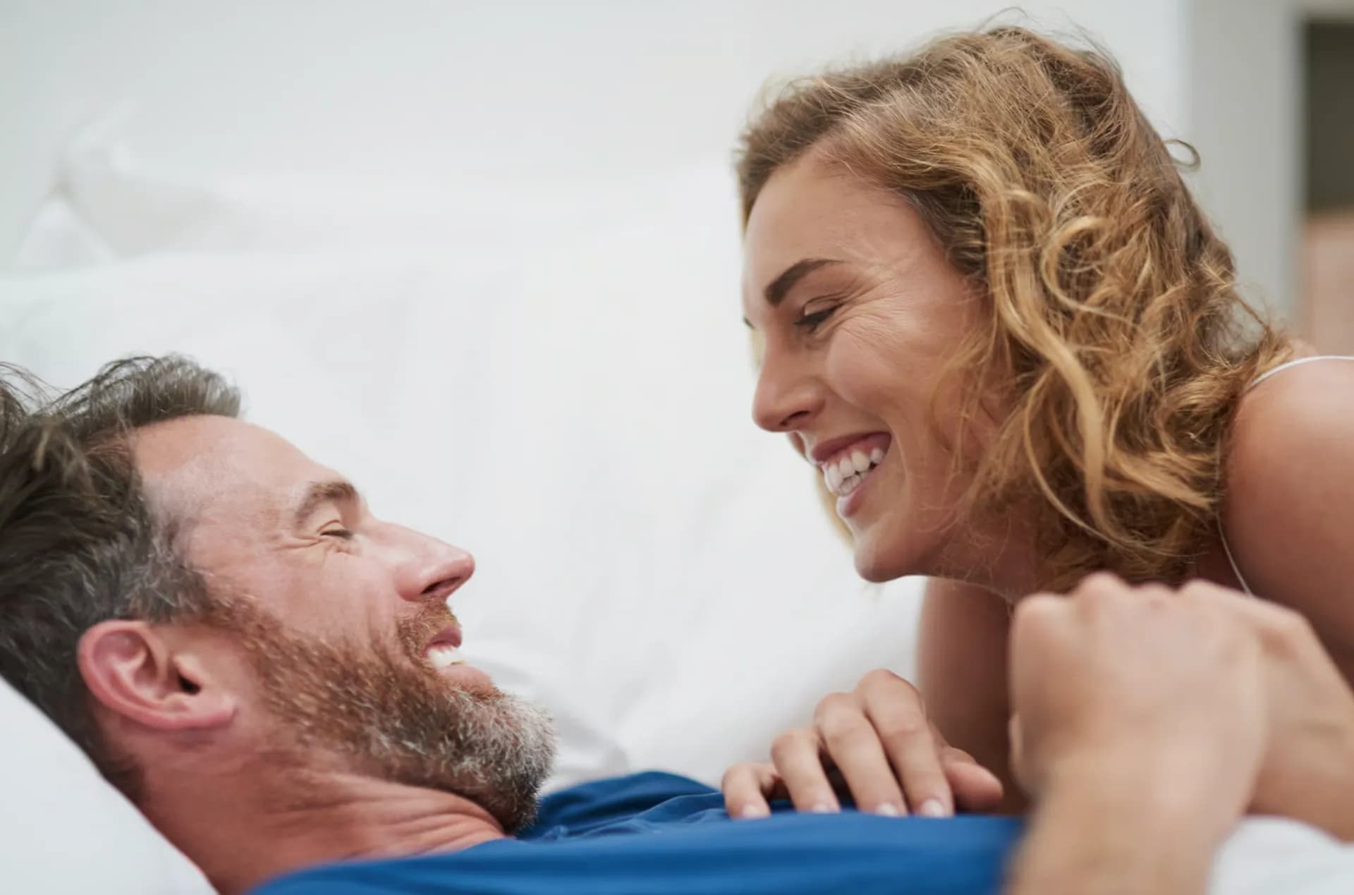 A smiling couple relaxing together at home